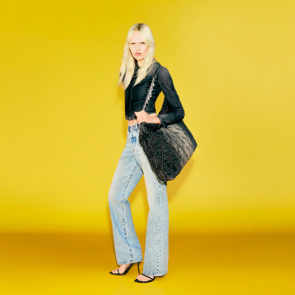 A woman wearing a pair of high-waisted jeans from Diesel