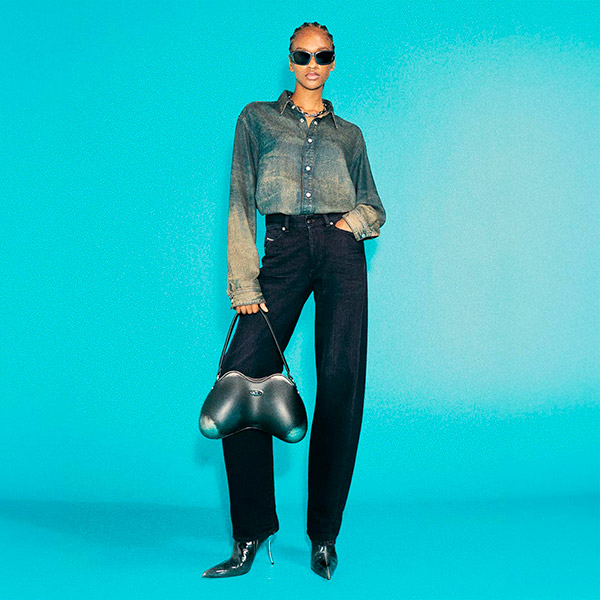 Woman wearing a pair of barrel-leg denim from Diesel